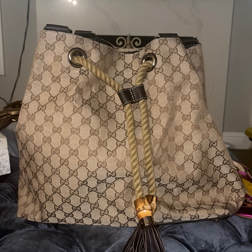 Price firm. Gucci canvas with rope drawstring